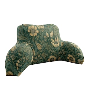 May include: A backrest pillow with armrests, adorned with a floral pattern in green and cream hues. The design showcases stylized flowers and foliage, offering a vintage appeal. The pillow is crafted for comfort and support.