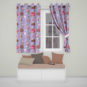 May include: Two light purple curtains featuring a repeating pattern of cartoon desserts including pink frosted doughnuts, chocolate brownies, ice cream cones, and marshmallows with smiling faces. The curtains hang on a rod over a window.