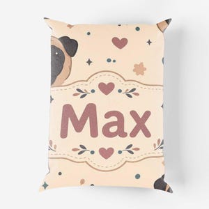 May include: A rectangular throw pillow with a light beige background featuring a repeating pattern of pug faces, small hearts, and stars. The centre displays a decorative frame containing the name Max in large, bold, dark pink lettering.
