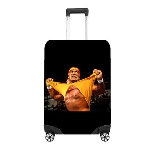 May include: Black rolling suitcase with a bold image of a wrestler holding up a yellow garment. The wrestler is wearing a red bandana and has a muscular physique. The background is a blurred crowd.
