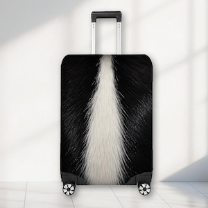 May include: A rectangular upright suitcase featuring a black and white fur-like pattern. The design displays a central vertical white stripe flanked by black sections, mimicking animal fur. It includes a retractable silver handle and four wheels.
