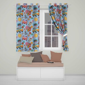 May include: Light blue curtains featuring a repeating pattern of colourful camper vans, acoustic guitars, palm trees, suns, cameras, and flowers. The fabric is hung on a white rod, with one panel pulled to the side to reveal a window view.