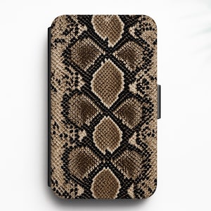 May include: A rectangular phone case featuring a repeating brown, tan, and black snakeskin pattern. The design displays a detailed, textured scale print covering the entire front surface of the case, with a solid black edge visible on the side.