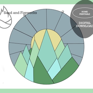 Puede incluir: Gráfico de descarga digital con un paisaje montañoso dentro de un círculo segmentado. El diseño incluye montañas en tonos verdes y azules, un sol amarillo y el texto "Sand and Fireworks" y "HOME PRINTABLE DIGITAL DOWNLOAD".