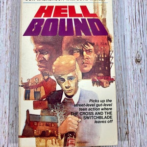 May include: A paperback book cover with a purple and white title "HELL BOUND" and a colorful illustration of three men. The text on the cover reads "Picks up the street-level gut-level teen action where THE CROSS AND THE SWITCHBLADE leaves off."