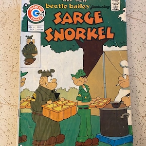 May include: A vintage comic book featuring Beetle Bailey and Sarge Snorkel. The cover is primarily green and orange, with cartoon illustrations of military characters. The comic book is from September 1975.