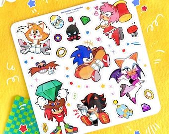 May include: A set of 12 colorful stickers featuring characters from the Sonic the Hedgehog video game franchise. The stickers include Sonic, Tails, Knuckles, Amy, Shadow, Rouge, and Eggman. The stickers are printed on white glossy paper and are perfect for decorating laptops, water bottles, and other surfaces.