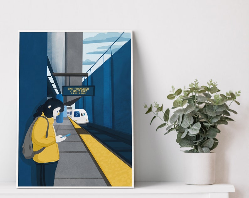 May include: A woman in a yellow jacket stands on a platform at a train station. The train station sign reads "San Francisco / Daly City". A white train is pulling into the station.