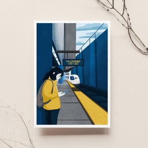 May include: A woman in a yellow jacket stands on a platform at a train station. A white train with the words "San Francisco / Daly City" on a sign is pulling into the station.