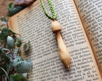 Hand carved wood mushroom with green cotton cord