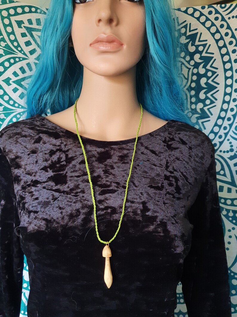 Hand carved wood mushroom with green cotton cord