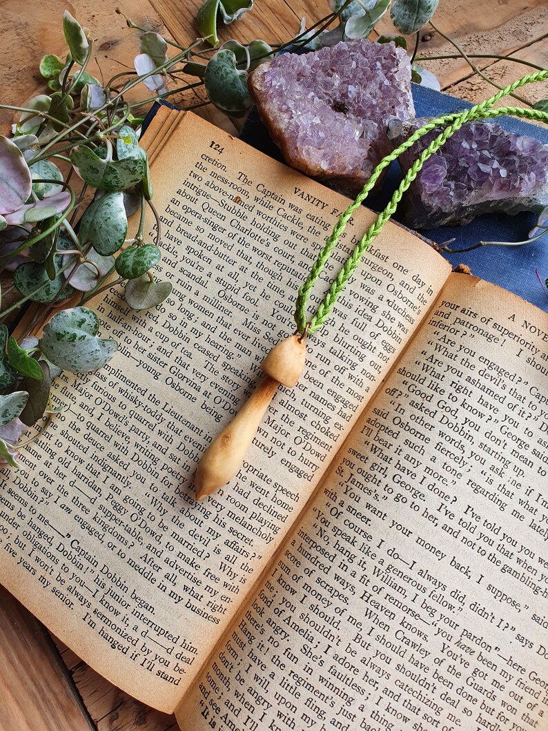 Hand carved wood mushroom with green cotton cord