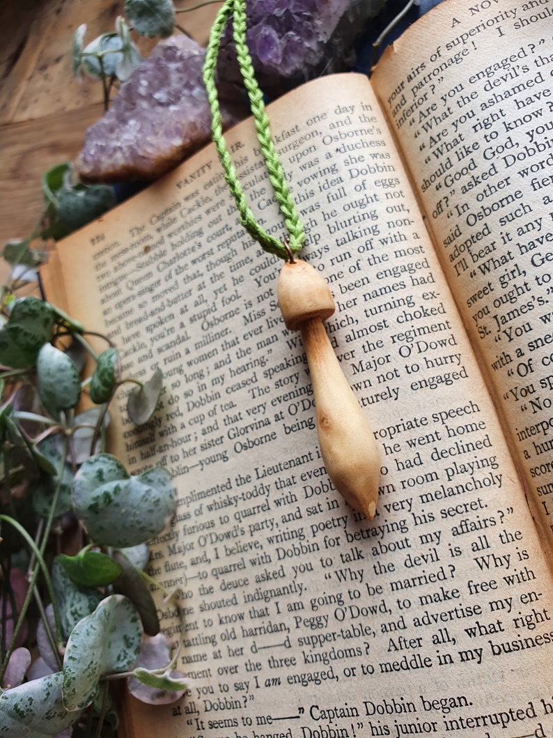 Hand carved wood mushroom with green cotton cord