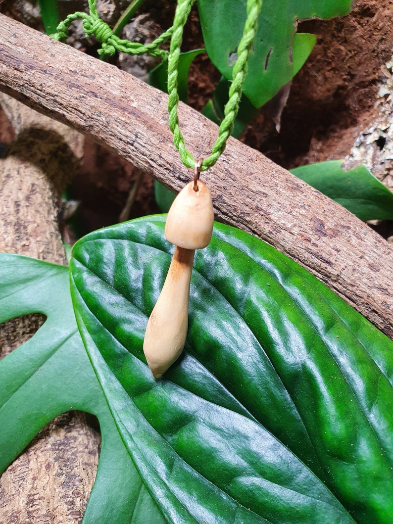 Hand carved wood mushroom with green cotton cord