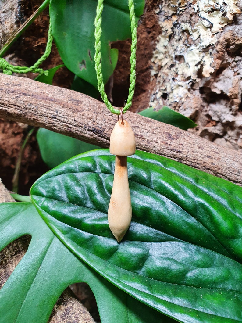 Hand carved wood mushroom with green cotton cord