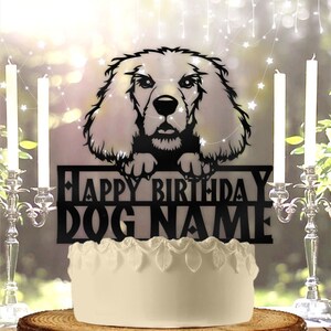 May include: Black cake topper featuring a silhouette of a Cocker Spaniel dog with the text "Happy Birthday DOG NAME".