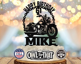 May include: Black acrylic cake topper with a motorcycle silhouette, the words "Happy Birthday 61 Mike", and the text "Design & Crafted by: Owl Top That Personalized Acrylic Gifts".