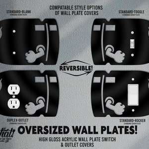 May include: Black oversized wall plate covers with various cutouts for switches and outlets. The plates feature a bullet-like design with an angry eye and a fist. Text on the image reads "OVERSIZED WALL PLATES!"