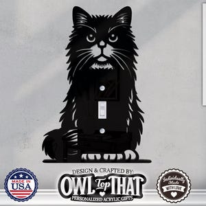 May include: Black metal silhouette of a cat with a light switch cutout. The switch plate is designed to fit standard US light switches and outlets. The image includes the text "OWL TOP THAT" and "PERSONALIZED ACRYLIC GIFTS".