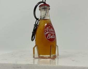 Llavero con forma de mochila de Nuka Cola inspirado en Fallout