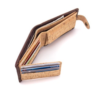 Open wallet displays natural cork interior with six card slots, one ID slot, coin pouch, and note storage area.