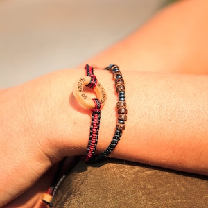 Shown on models wrist, Unisex customised Morse code bracelet made with metal and wooden beads, also pictured our Co-ordinate customised bracelet.