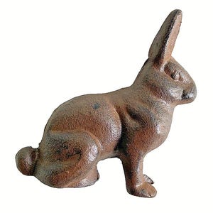 May include: A brown cast iron rabbit figurine in a seated position. The rabbit has long ears, a small tail, and detailed fur texture. The figurine is a decorative item, likely for home decor or garden use.