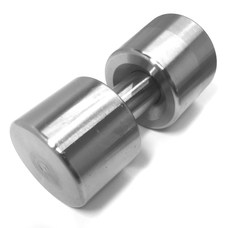 May include: A silver dumbbell with a smooth, cylindrical design. The dumbbell is made of metal and has a weight.