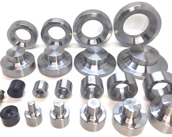 May include: A set of 20 metal rings and discs in various sizes. The rings and discs are silver in color and have a smooth, polished finish.