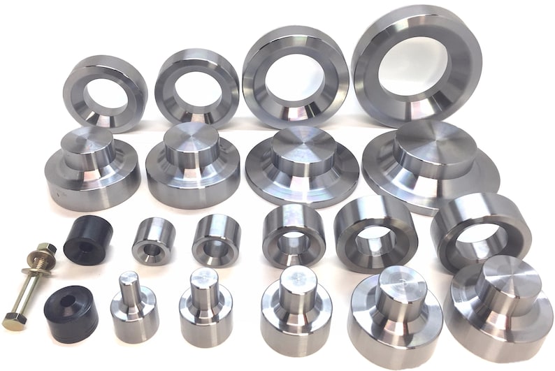 May include: A set of 20 metal rings and discs in various sizes. The rings and discs are silver in color and have a smooth, polished finish.