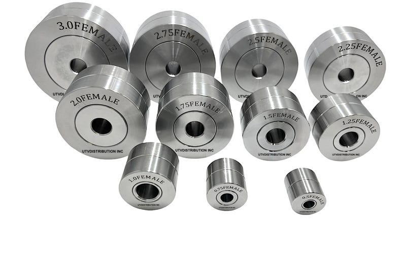 May include: A set of ten silver metal female die sets in various sizes, ranging from 0.5 inches to 3.0 inches. The die sets are labeled with their size and the company name "UTV Distribution Inc."