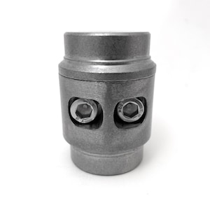 May include: A silver metal pipe clamp with two visible screws. The clamp is designed to secure pipes together.