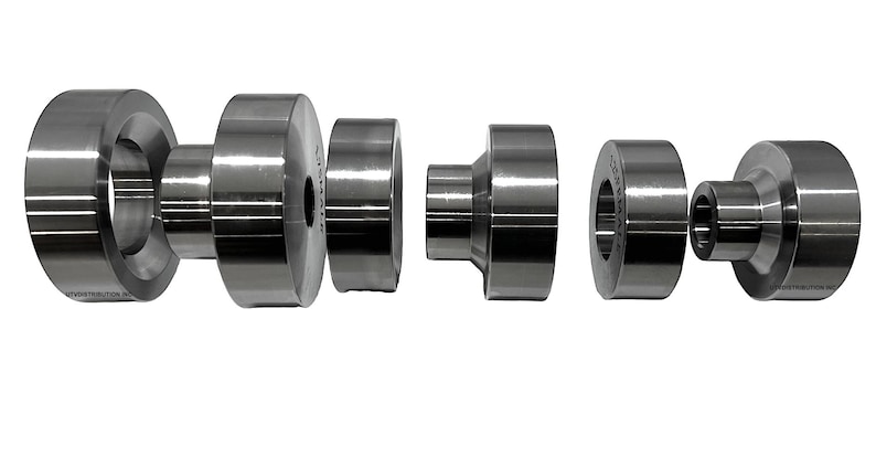 May include: Set of six silver metal punch tools for crafting. The tools are different sizes and shapes, with a round, cylindrical design.