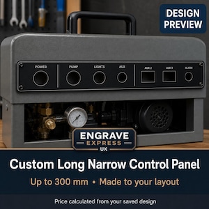May include: A grey rectangular control panel with a black faceplate featuring labels for Power, Pump, Lights, Aux, Aux 2, Aux 3, and Alarm. The unit has a top handle and is mounted on a machine with visible brass fittings and a pressure gauge.
