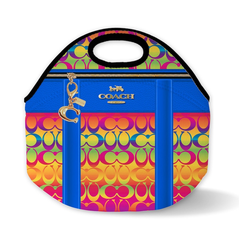 May include: A blue and rainbow Coach lunch bag with a gold zipper and a gold Coach logo. The bag has a rainbow pattern with the Coach logo repeated throughout.