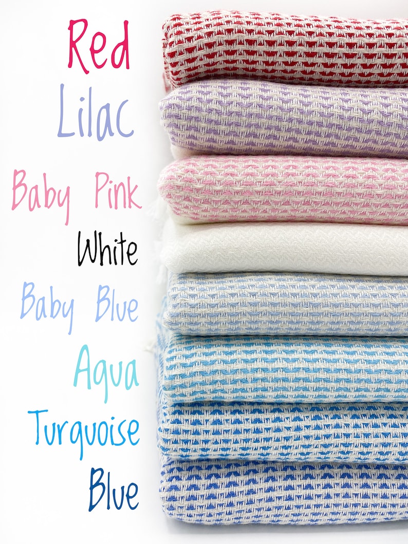 May include: A stack of eight folded woven textiles in various colors including red, lilac, baby pink, white, baby blue, aqua, turquoise, and blue. Each textile features a consistent textured weave pattern and is labeled with its color name.