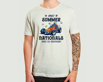 May include: A white t-shirt featuring a vintage-style graphic of a racing car. The graphic includes the text "1967 Summer Nationals Sprint Car Championship".