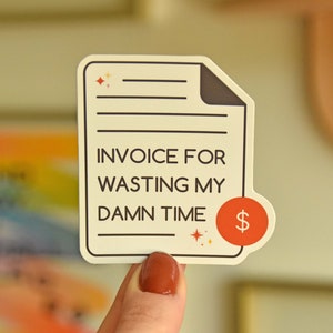 An invoice-shaped die cut sticker that reads invoice for wasting my damn time. It's a perfect coworker gift.
