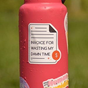 An invoice-shaped die cut sticker that reads invoice for wasting my damn time. It's a perfect coworker gift.