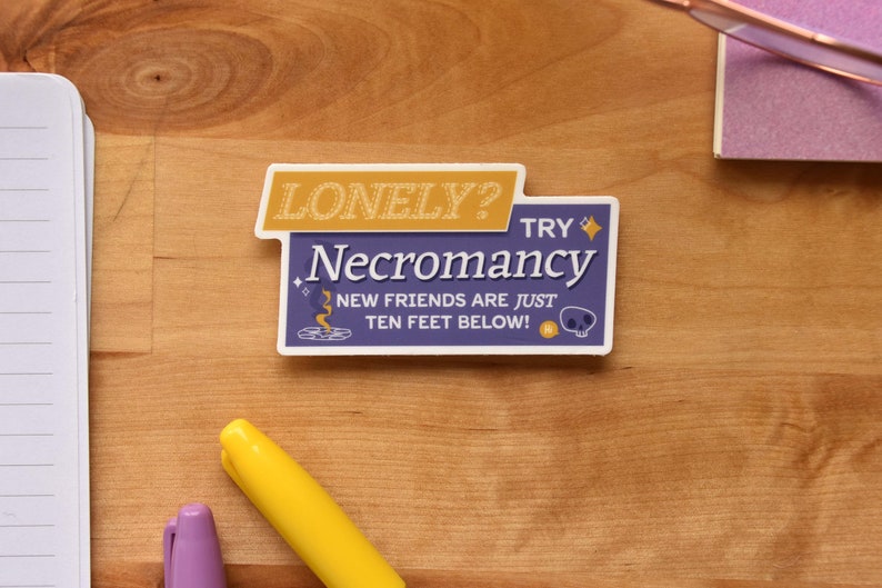 A die cut vinyl sticker in a typographic design. It reads "Lonely? Try Necromancy. New friends are just ten feet below!" A friendly looking skull says "Hi" alongside a summoning circle with swirling magic. The finish is matte and waterproof.