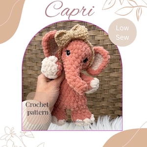 May include: A coral-colored crochet elephant toy with a beige bow and white accents. The elephant has a trunk, large ears, and small black eyes. The text "Capri" is above the elephant, and "Crochet pattern" is in the lower left corner.