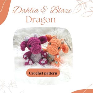 May include: Two crocheted dragon toys, one magenta and gray, the other orange and teal, sit on a white fluffy surface. The text "Dahlia & Blaze Dragon" is above them, with "Crochet pattern" below. The dragons have large ears and small horns.