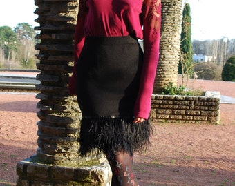 Black knit pencil skirt with ostrich feather trim