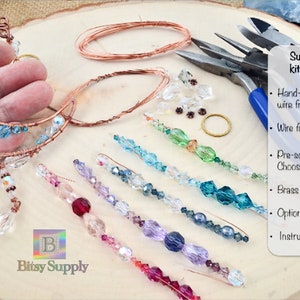 May include: A suncatcher kit with a copper wire moon frame, assorted crystals, wire for wrapping, a brass ring for hanging, and optional jewelry pliers. The kit includes instructions for making a suncatcher.