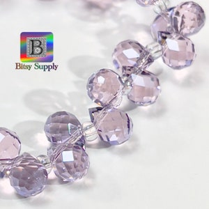 May include: A strand of light purple faceted crystal beads with clear thread.
