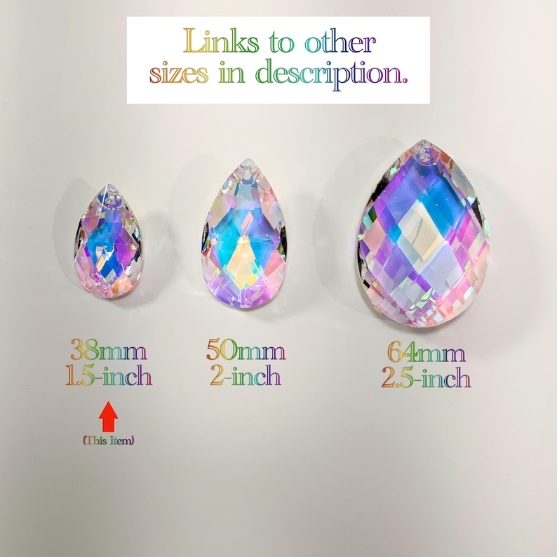 May include: Three iridescent teardrop crystal prisms in different sizes. The smallest is 1.5 inches, the middle is 2 inches, and the largest is 2.5 inches.