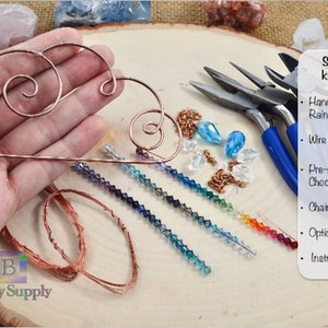 May include: A suncatcher kit with a hand-forged copper wire frame, wire for wrapping, pre-sorted crystals, a chain for hanging, optional jewelry pliers, and an instructional video. The kit includes a variety of colors of crystals.