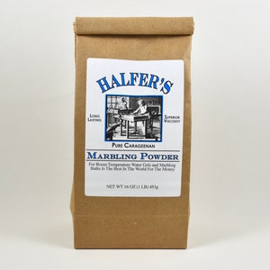 May include: A brown paper bag with a white label that reads "HALFER'S" in blue lettering. The label also includes the text "LONG LASTING", "SUPERIOR VISCOSITY", "PURE CARAGEENAN", "MARBLING POWDER", "For Room Temperature Water Gels and Marbling Baths Is The Best In The World For The Money", and "NET WT 16 OZ (1 LB) 450g".