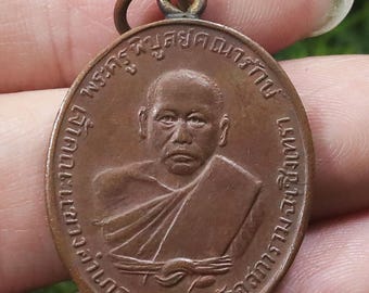 Luang Pho Ding Thai Amulet: 1938 First Edition Copper Buddha Pendant