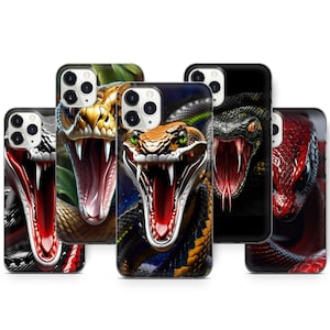 May include: A selection of phone cases with striking snake designs. Each case displays a different snake, with open mouths and visible fangs. The cases are black and have a glossy finish, showcasing the snakes' vibrant colours and patterns.
